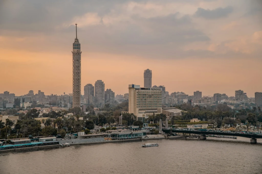 Cairo Tower and skyline over the Nile at dusk