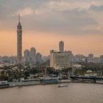 Cairo Tower and skyline over the Nile at dusk