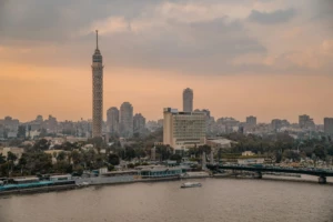 Cairo Tower and skyline over the Nile at dusk
