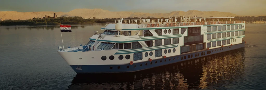 Acamar Nile cruise ship on the Nile at sunset