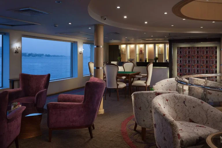 Acamar lounge with armchairs by river windows