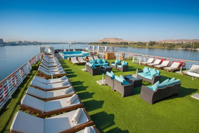Acamar sun deck with loungers and sofas on artificial grass