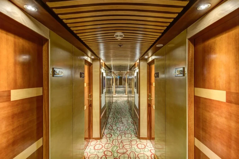 Wood-panelled cabin corridor on the Esmeralda