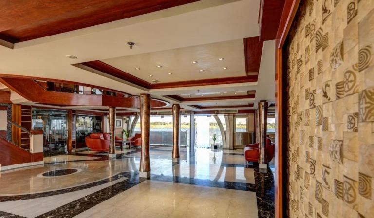 Esmeralda lobby with marble floor and hieroglyph-carved wall