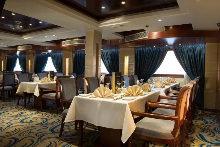 Esmeralda dining room with tables set in white linen