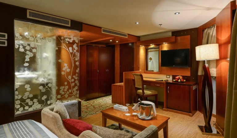 Esmeralda cabin with desk, TV and sofa seating