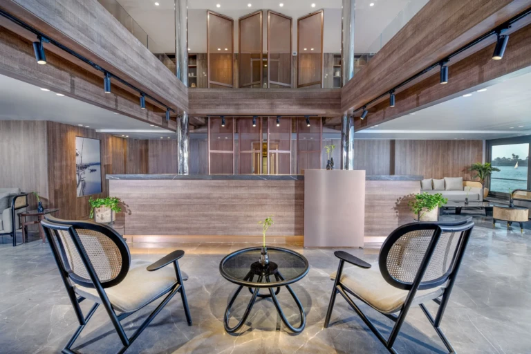 Historia double-height lobby with reception desk and chairs
