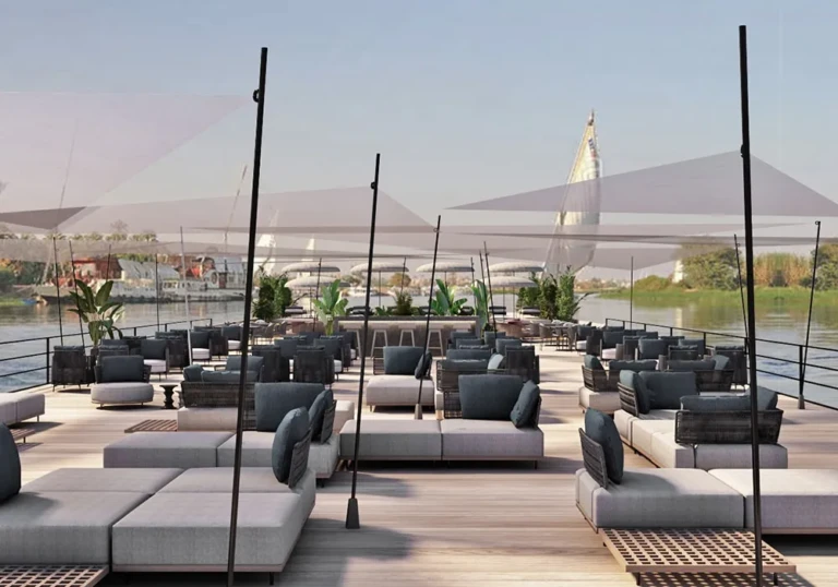 Rows of outdoor sofas under sail shades on the Historia sun deck