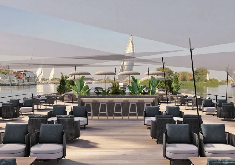 Shaded sun deck bar and lounge seating on the Historia