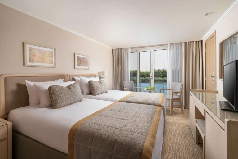Twin bed cabin with desk and balcony door
