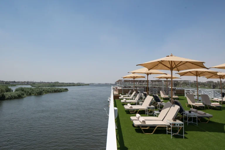 Jaz Regent sun deck with loungers and parasols along the Nile