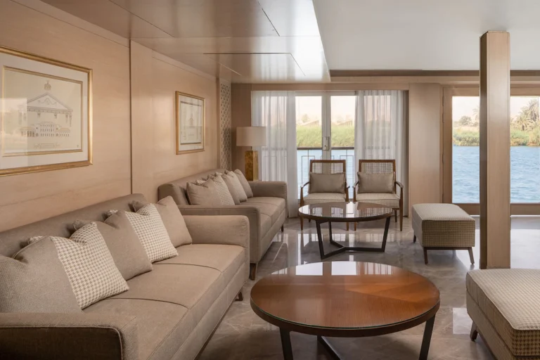Sitting area with sofas, round tables and Nile view