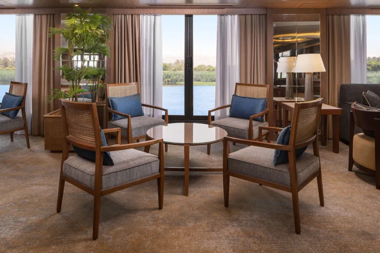 Lounge armchairs around a table by Nile windows