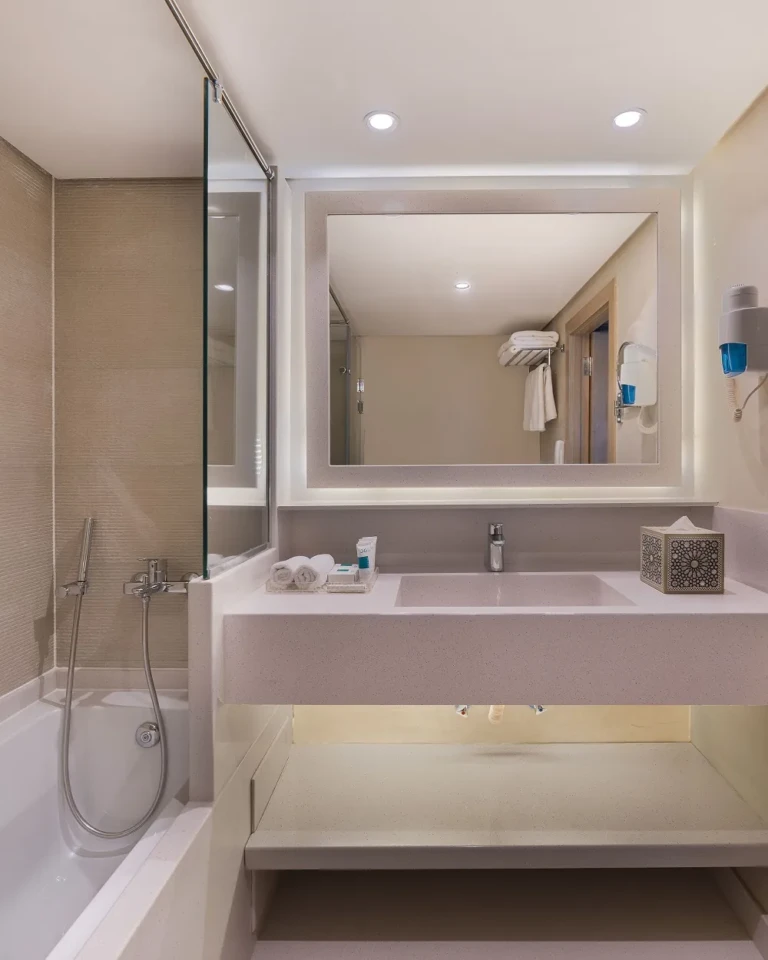 Jaz Viceroy bathroom with bathtub and backlit mirror