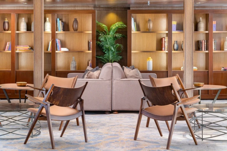 Jaz Viceroy library lounge with bookshelves and armchairs