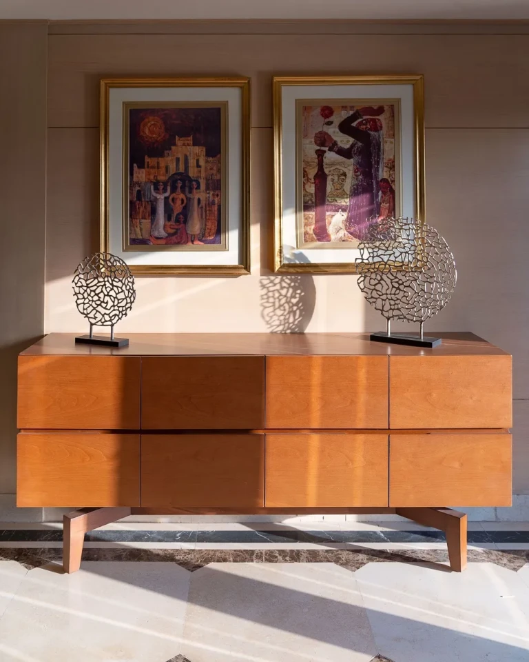 Sideboard with framed Egyptian-themed art on the Jaz Viceroy