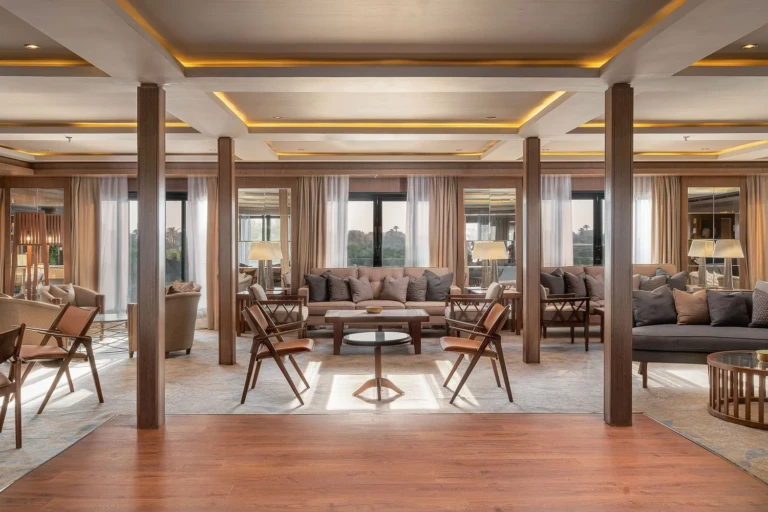 Jaz Viceroy lounge with sofas, wooden chairs and columns