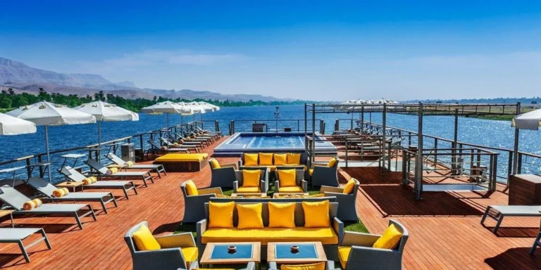 Sun deck with yellow lounge seating and plunge pool on Oberoi Philae