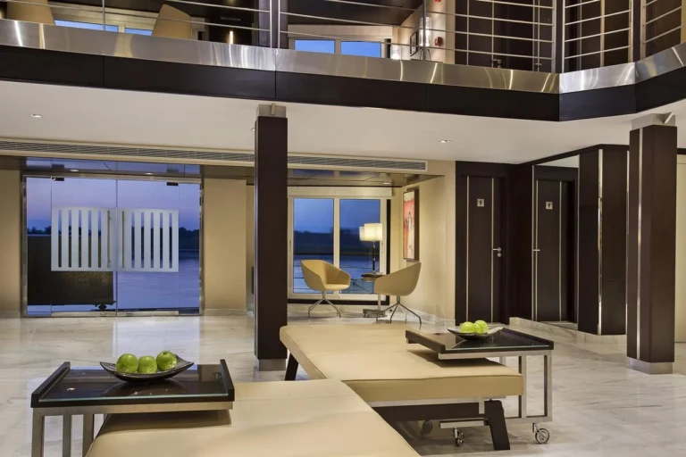 Oberoi Philae lobby with gallery balcony and glass entrance doors