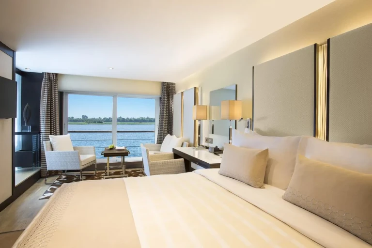Oberoi Philae cabin bed facing a panoramic Nile window