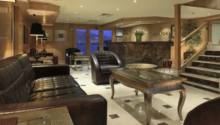 Lobby with leather sofas and staircase on MS Jaz Senator