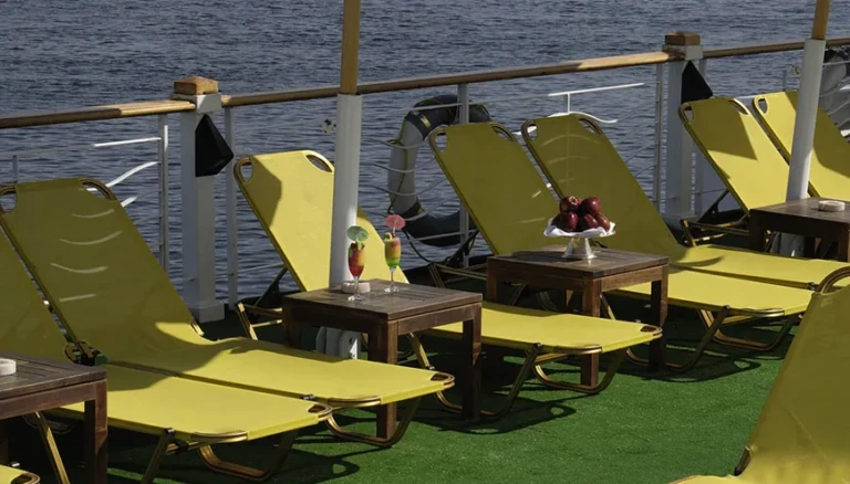 Yellow sun loungers along the deck railing on MS Jaz Senator