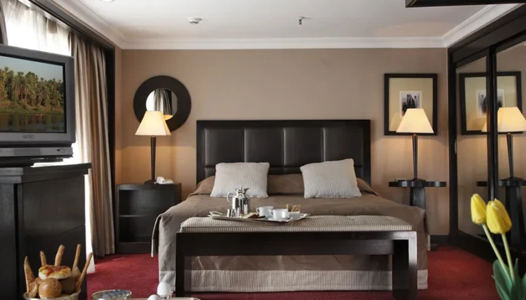 Double bed with leather headboard in an MS Jaz Senator cabin