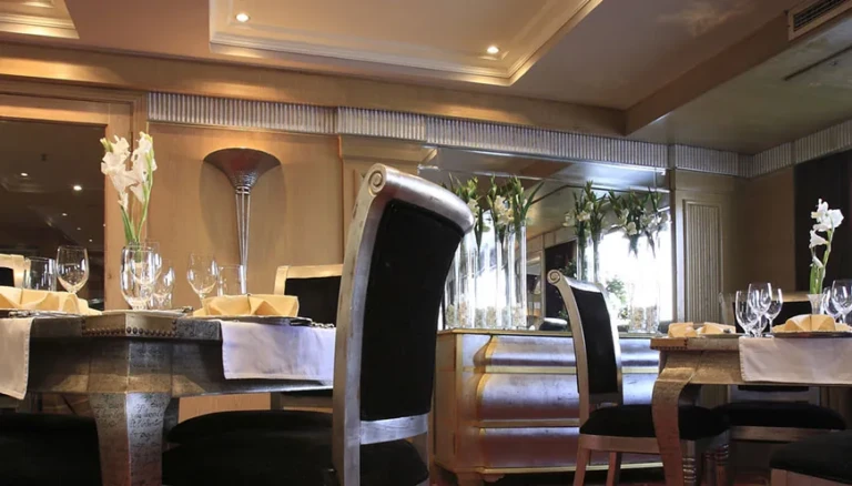 Dining tables with tall black chairs on MS Jaz Senator