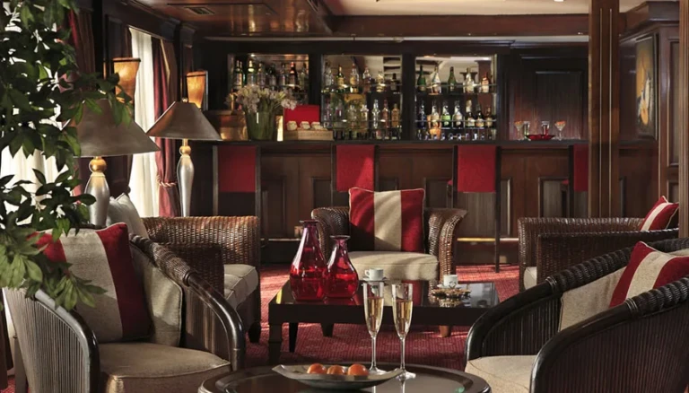 Bar with bottle shelves and armchairs on MS Jaz Senator