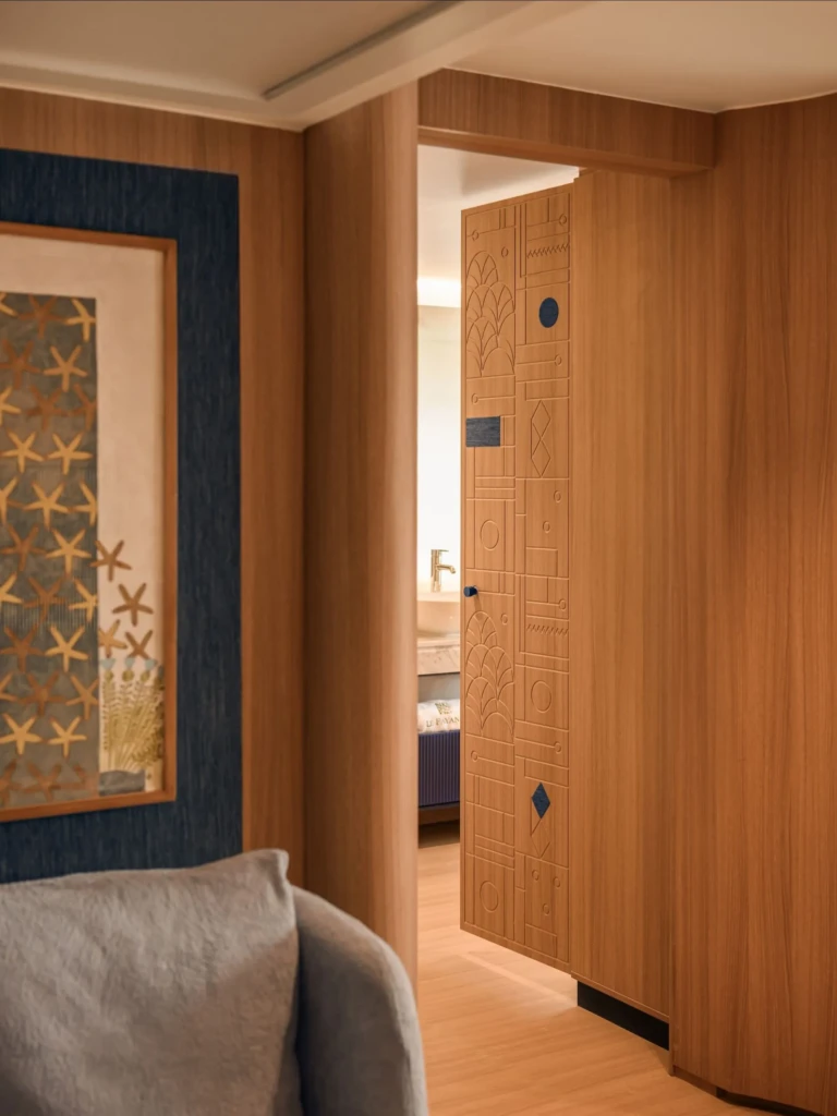 Wood-panelled cabin doorway with framed star artwork