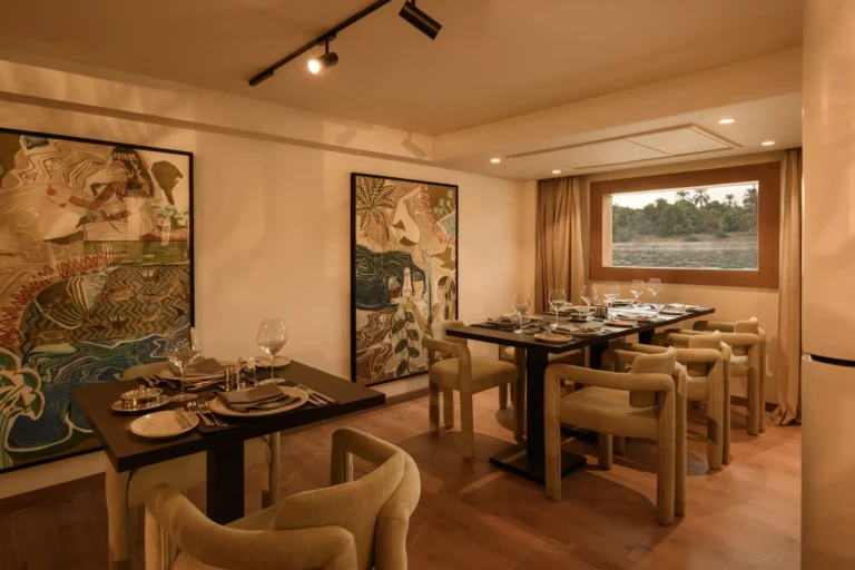 Private dining room with large artworks and window on Le Fayan