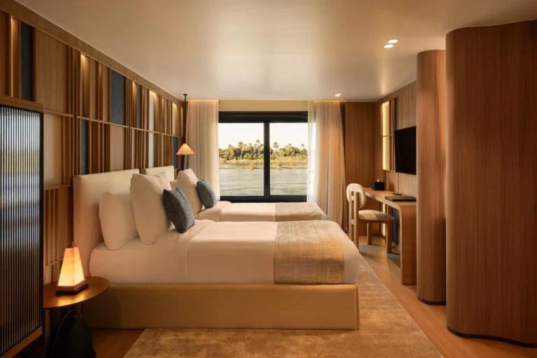 Le Fayan cabin with double bed, desk and Nile view window