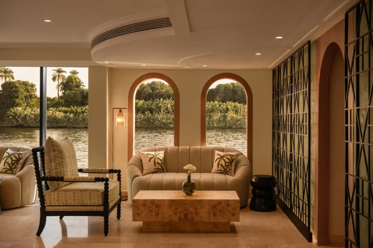 Lounge corner with sofa and arched Nile windows on Le Fayan