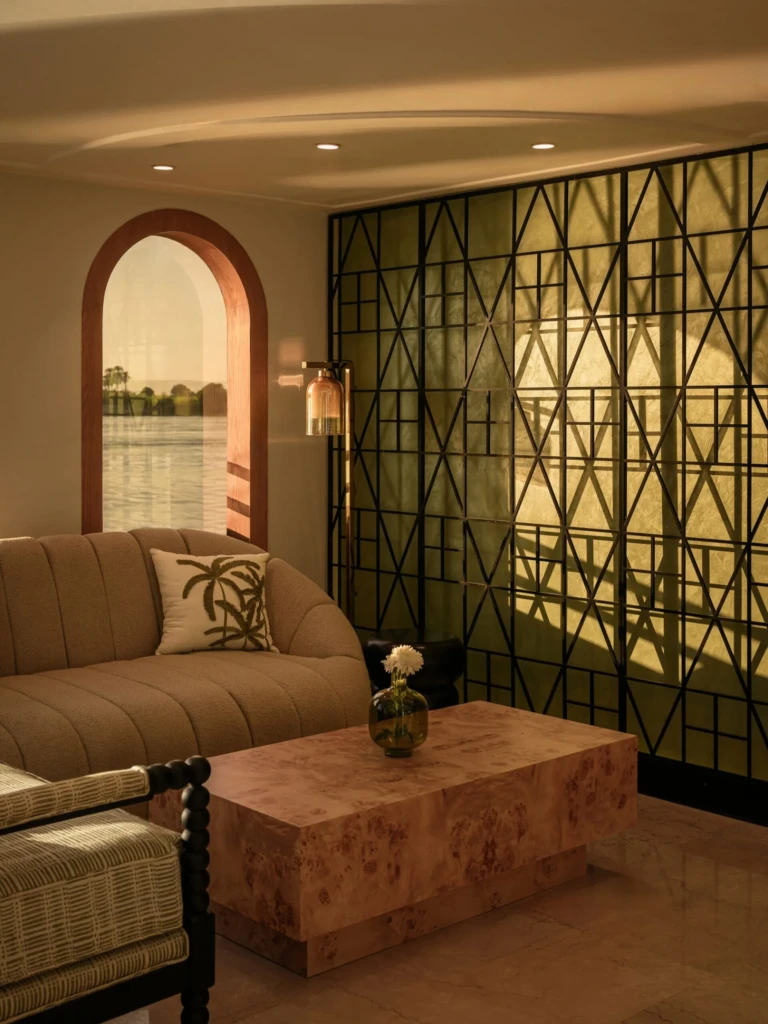 Le Fayan lounge with sofa, arched window and geometric screen