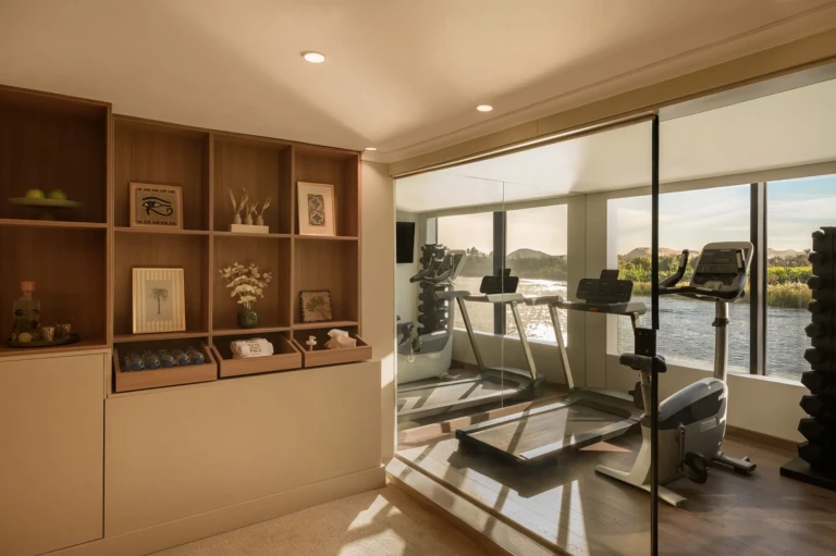 Le Fayan gym with treadmills and river view windows