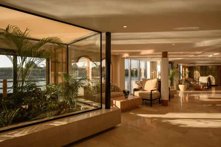 Le Fayan lobby with indoor plant garden and lounge chairs