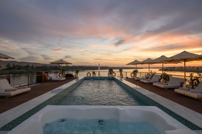 Le Fayan pool and jacuzzi at sunset with sun loungers