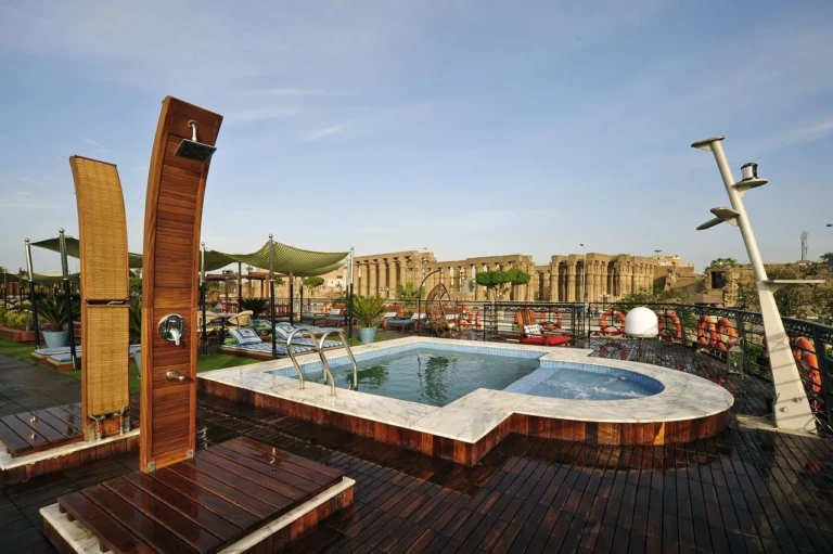 MS Mayfair pool deck with outdoor shower and temple ruins behind