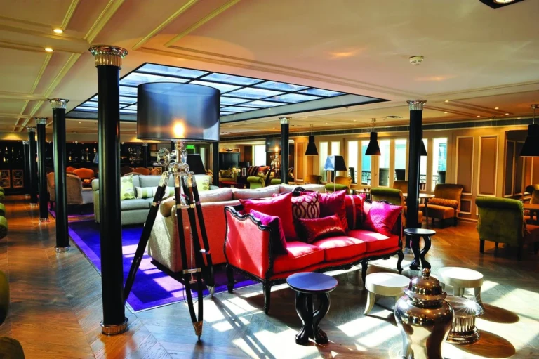 MS Mayfair lounge with red sofa under a glass skylight