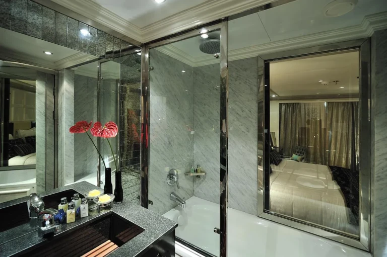Glass-walled shower and vanity in an MS Mayfair bathroom