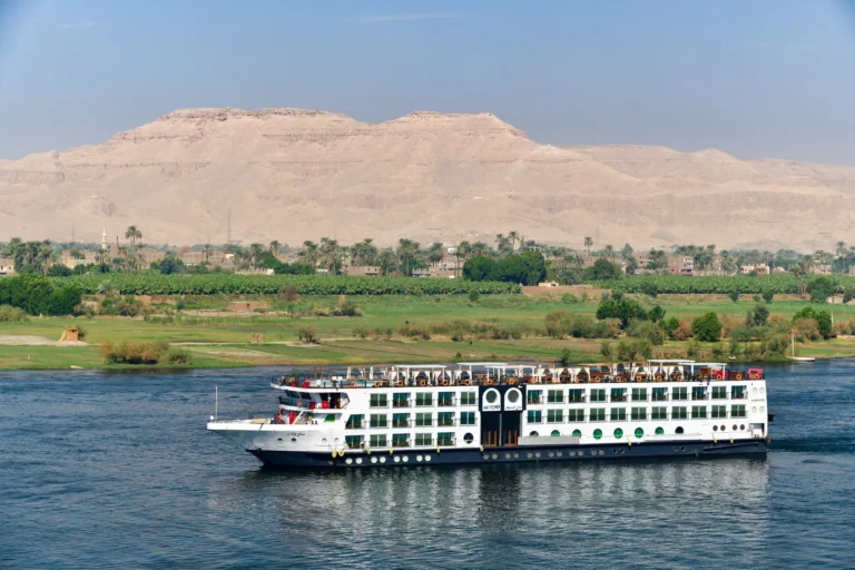 MS Mayflower cruise ship sailing the Nile below desert hills