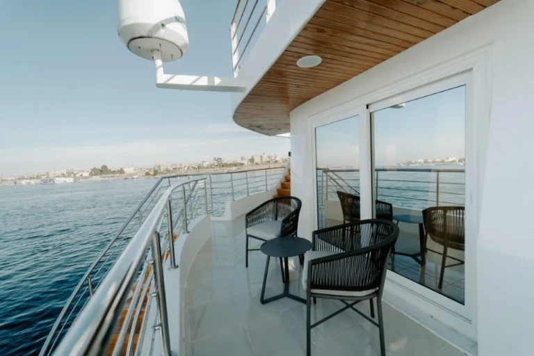 Private balcony with chairs and table overlooking the Nile