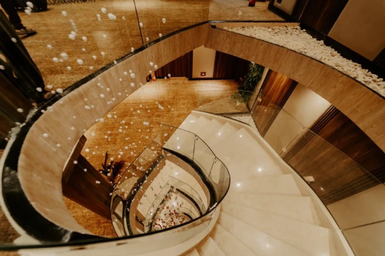 Spiral staircase with hanging crystal lights seen from above