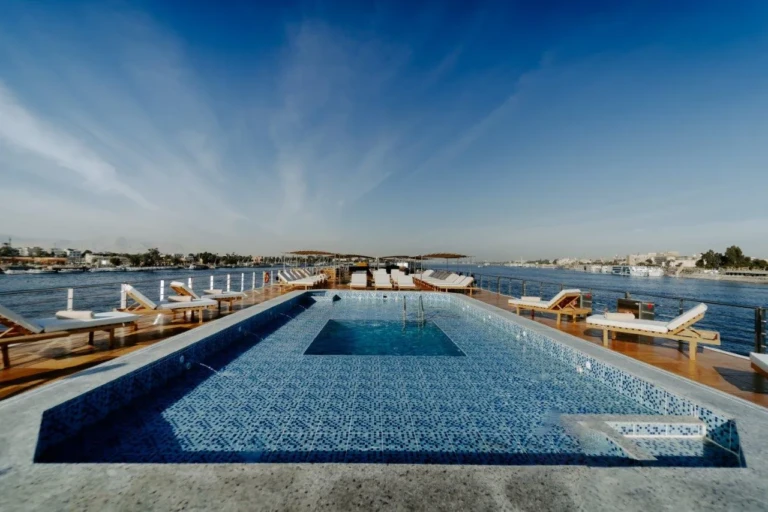 Sun deck pool with loungers alongside the Nile