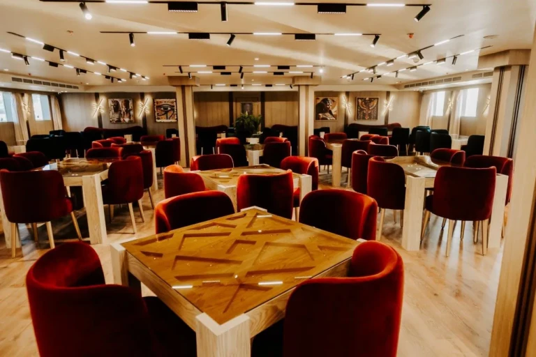 Restaurant table with red velvet chairs