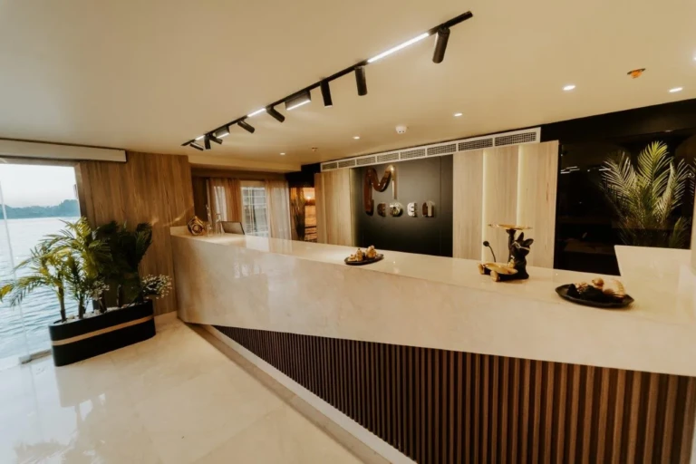 Reception desk with marble counter and potted plants