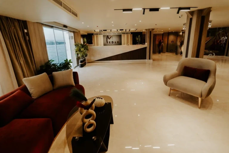 MS Medea lobby with red sofa and grey armchair