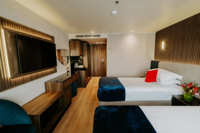 Twin cabin with wall TV and wooden desk