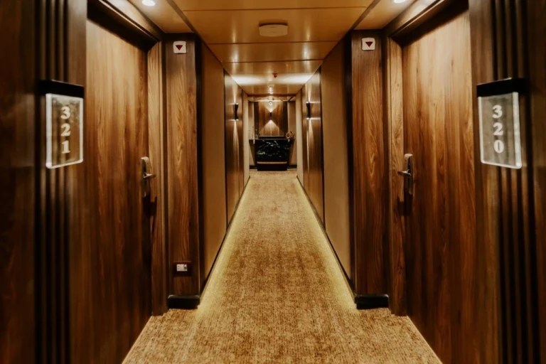 Cabin corridor with numbered wooden doors