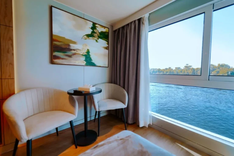 Reading corner with side table and river window on MS Miriam